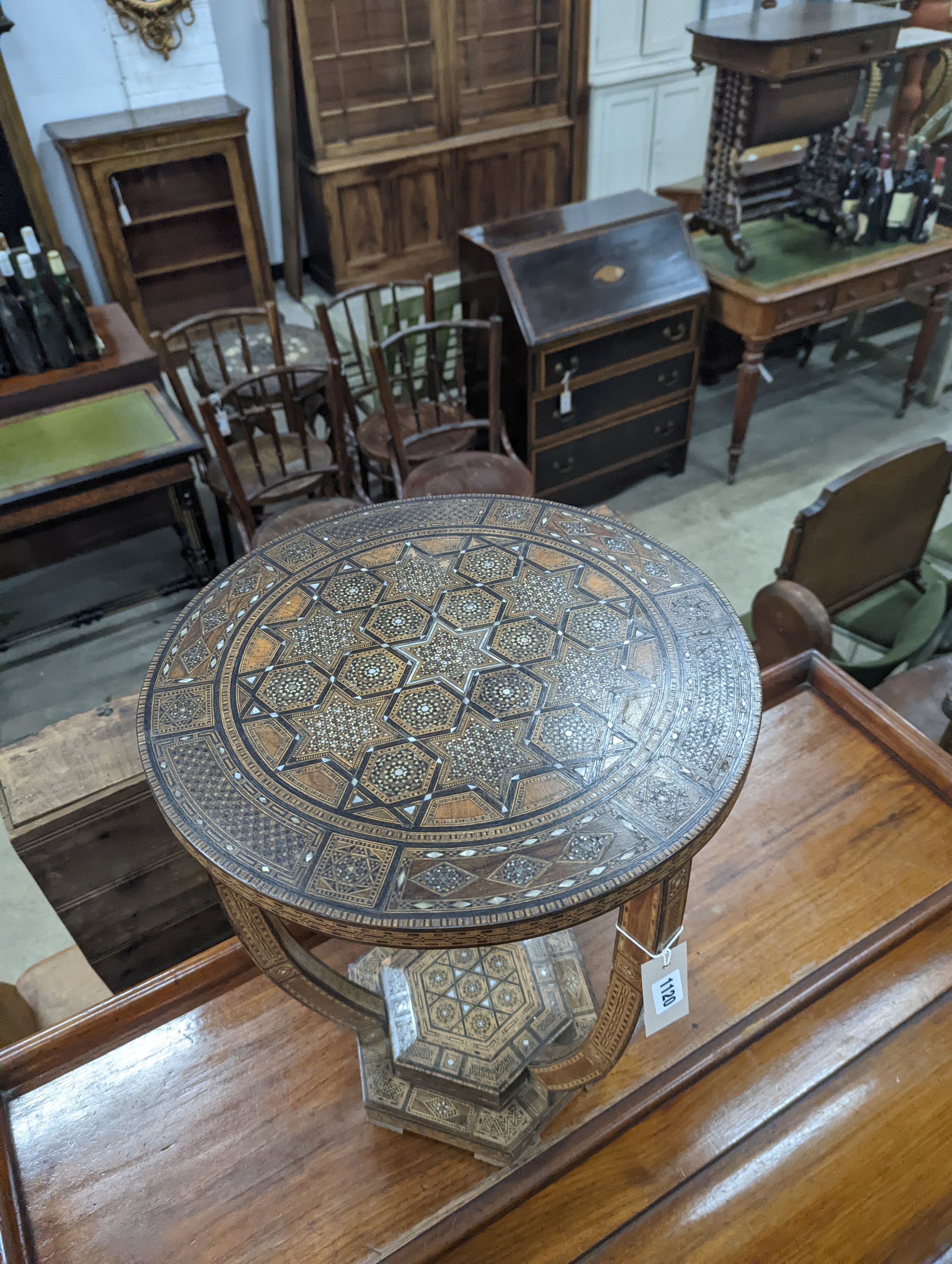 A Moorish bone and parquetry inlaid two tier occasional table, diameter 41cm, height 52cm